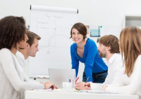 Businesswoman giving a presentation to her team